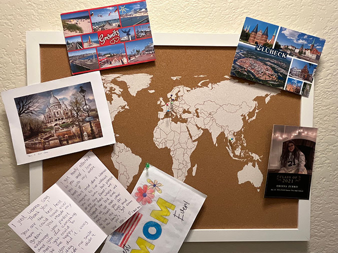 Morgan’s pin board and cards from former exchange students