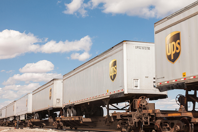 UPS trailers on flat cars